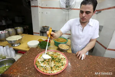 Palestinians prepare chickpeas known as hummus for breakfasting during the holy fasting month of Ramadan in Gaza city, on June 23, 2016. Muslims around the world refrain from eating, drinking and sexual intercourse from...