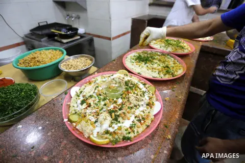 Palestinians prepare chickpeas known as hummus for breakfasting during the holy fasting month of Ramadan in Gaza city, on June 23, 2016. Muslims around the world refrain from eating, drinking and sexual intercourse from...