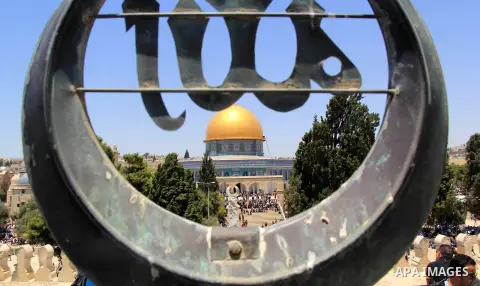 Palestinian Muslim worshippers perform Friday prayer in front of the Dome of the Rock mosque at the al-Aqsa mosque compound in Jerusalem's old city on June 24, 2016 during the holy fasting month of Ramadan. Photo by Mahf...