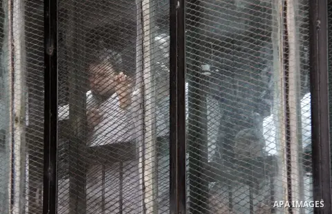 Suspects of Ansar Bait Al-Maqdis group, attend their trial in Cairo on June 25, 2016, on charges of assassination of police officers, attempted assassination of interior minister Mohamed Ibrahim and explosions near secur...