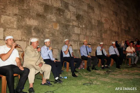 Palestinians attend a ceremony in front of Damascus gate in Jerusalem's old city during the holy fasting month of Ramadan on June 25, 2016. Ramadan is sacred to Muslims because it is during that month that tradition says...