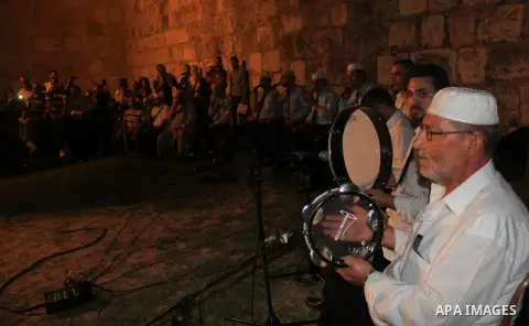 Palestinians attend a ceremony in front of Damascus gate in Jerusalem's old city during the holy fasting month of Ramadan on June 25, 2016. Ramadan is sacred to Muslims because it is during that month that tradition says...