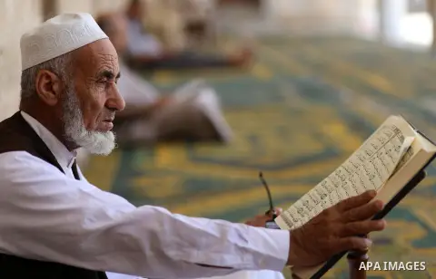 Palestinian Muslims read the Koran, Islam's holy book, at Sayed Hashim Mosque, during the Muslim holy month of Ramadan, in Gaza city on June 27, 2016. Ramadan is sacred to Muslims because it is during that month that tra...