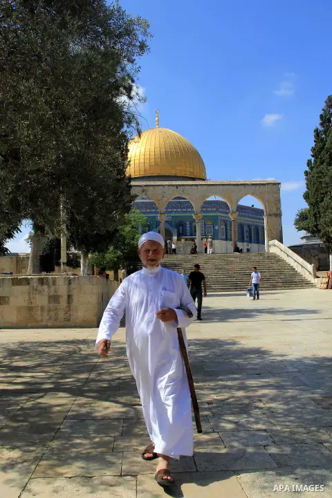Palestinian men walk outside Jerusalem's al-Aqsa mosque after clashes erupted at the compound between Palestinians and Israeli police, on June 28, 2016. An Israeli police spokesman said on Tuesday that the compound would...