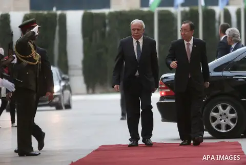 United Nations Secretary General Ban Ki-moon walks alongside Palestinian foreign minister Riyad al-Malki as he arrives at the Muqataa, the Palestinian Authority headquarters, in the West Bank city of Ramallah, on June 28...