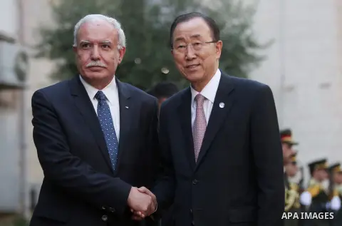 United Nations Secretary General Ban Ki-moon walks alongside Palestinian foreign minister Riyad al-Malki as he arrives at the Muqataa, the Palestinian Authority headquarters, in the West Bank city of Ramallah, on June 28...