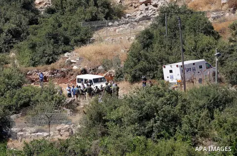 Israeli security forces gather near the scene of what the Israeli military said was an attack by Palestinian in the Jewish settlement of Kiryat Arba near the West Bank city of Hebron 30 June 2016. Israeli army said the P...