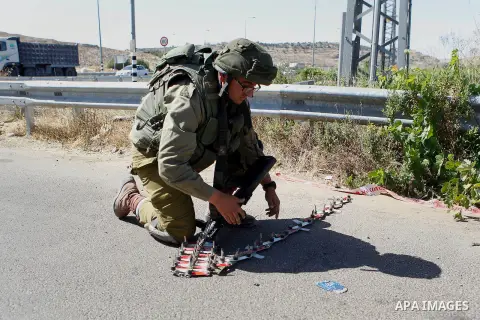 Israeli security forces gather near the scene of what the Israeli military said was an attack by Palestinian in the Jewish settlement of Kiryat Arba near the West Bank city of Hebron 30 June 2016. Israeli army said the P...