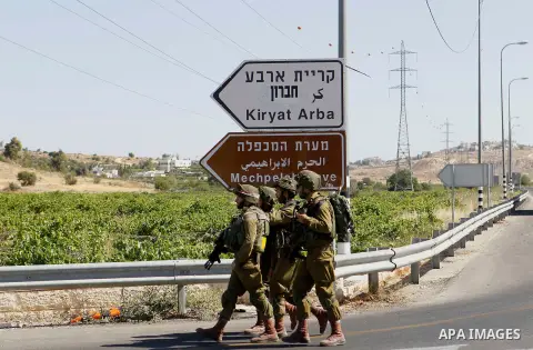 Israeli security forces gather near the scene of what the Israeli military said was an attack by Palestinian in the Jewish settlement of Kiryat Arba near the West Bank city of Hebron 30 June 2016. Israeli army said the P...