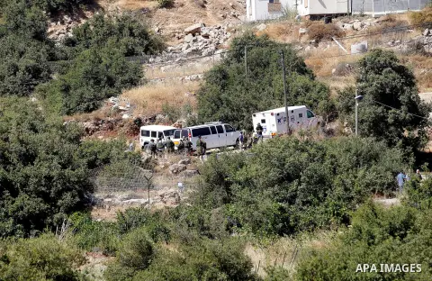 Israeli security forces gather near the scene of what the Israeli military said was an attack by Palestinian in the Jewish settlement of Kiryat Arba near the West Bank city of Hebron 30 June 2016. Israeli army said the P...
