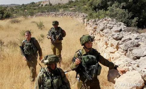 Israeli security forces gather near the scene of what the Israeli military said was an attack by Palestinian in the Jewish settlement of Kiryat Arba near the West Bank city of Hebron 30 June 2016. Israeli army said the P...