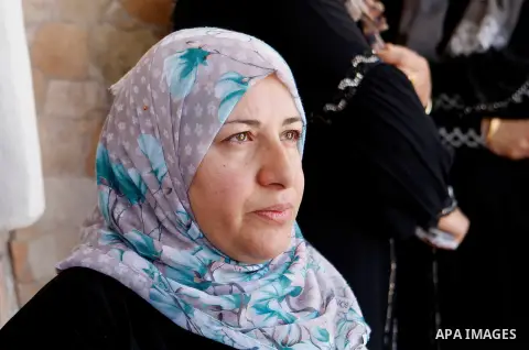 The Mother of Palestinian Mohammed Nasser Tarayra, who stabbed to death an Israeli teen in a Jewish settlement in the occupied West Bank on June 30,2016 is seen outside her family home in the village of Bani Naim, near t...