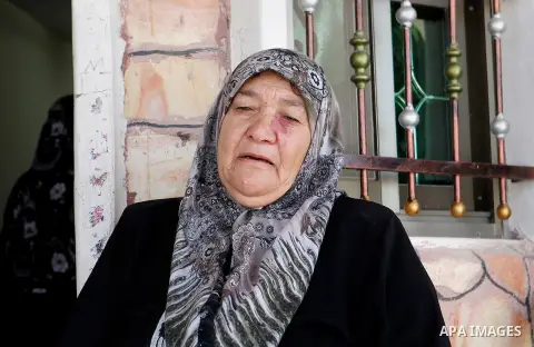 The grandmother of Palestinian Mohammed Nasser Tarayra, who stabbed to death an Israeli teen in a Jewish settlement in the occupied West Bank on June 30,2016 is seen outside her family home in the village of Bani Naim, n...