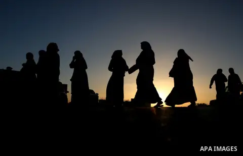 Palestinians make their way through Israeli Qalandia checkpoint to attend the last Friday prayer of the holy fasting month of Ramadan in Jerusalem's al-Aqsa mosque, near the West Bank city of Ramallah July 1, 2016. Photo...