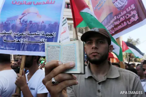 Palestinians take part in a rally marking al-Quds (Jerusalem) Day following Friday prayer in Gaza city on July 1, 2016. Photo by Mohammed Asad