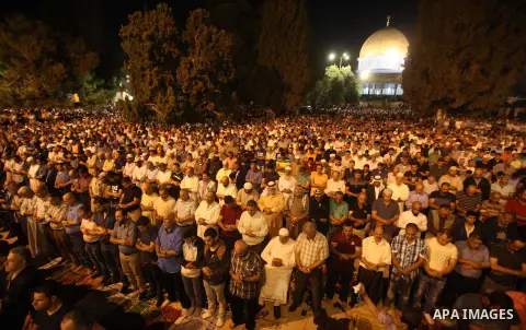 Palestinian muslim worshipers take part in Laylat Al Qadr prayers or Night of Power, in which the Muslim holy book of Koran was revealed to Prophet Mohammad by Allah on the 27th day of the holy fasting month of Ramadan i...