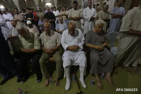 Palestinian Muslim worshippers pray overnight on July 2, 2016 at a Mosque in Gaza city on the occasion of Laylat al-Qadr which falls on the 27th day of the fasting month of Ramadan. Laylat al-Qadr, or Night of Destiny, m...