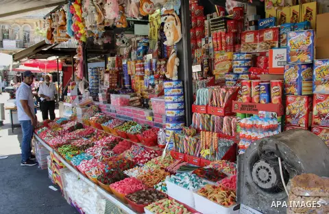 Palestinians shop at a market ahead of the Eid al-Fitr holiday, in Jerusalem old city, on July 3, 2016. Eid al-Fitr marks the end of Muslim's holy fasting month of Ramadan when faithfuls abstain from eating, drinking, sm...