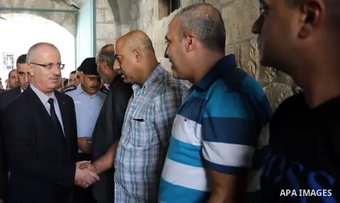 Palestinian Prime Minister Rami Hamdallah visits the mourning tent of Tayseer Habash, who died from tear gas fired by Israeli security forces during clashes, in the West Bank city of Nablus, on July 03, 2016. Photo by Pr...