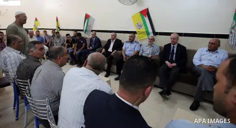 Palestinian Prime Minister Rami Hamdallah visits the mourning tent of a member of Palestinian security forces Annan Tabouk, in the West Bank city of Nablus, on July 03, 2016. Photo by Prime Minister Office