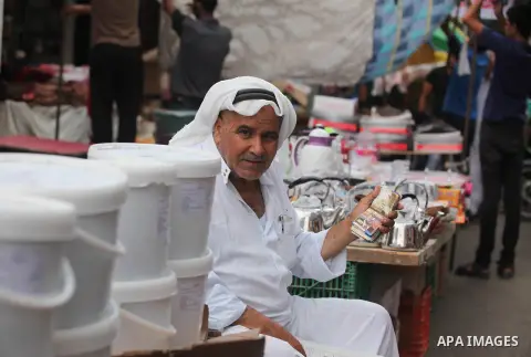 Palestinians shop at a market ahead of the Eid al-Fitr holiday, in Nuseirat refugee camp in the central Gaza Strip, on July 4, 2016. Eid al-Fitr marks the end of Muslim's holy fasting month of Ramadan when faithfuls abst...