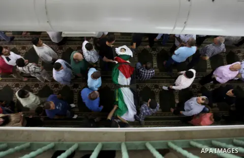 Mourners carry the body of Rayyan Shreem"3 years", a Palestinian child who was killed in the Istanbul airport attack blamed on the Islamic State (IS) group on June 28, during his funeral in the West Bank town of Qalqilya...