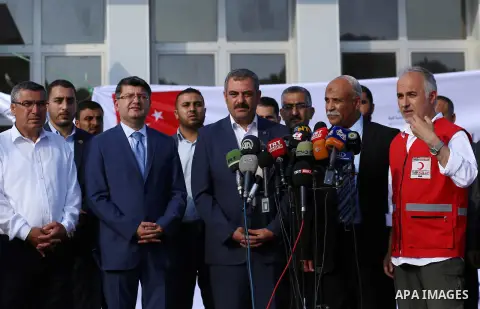 President of Turkish Red Crescent Kerem Kinik speaks during a press conference after humanitarian aid parcels provided by Turkey entered the southern Gaza Strip from Israel through the Kerem Shalom crossing July 4, 2016....