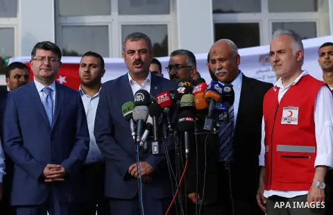 President of Turkish Red Crescent Kerem Kinik speaks during a press conference after humanitarian aid parcels provided by Turkey entered the southern Gaza Strip from Israel through the Kerem Shalom crossing July 4, 2016....