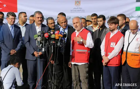 President of Turkish Red Crescent Kerem Kinik speaks during a press conference after humanitarian aid parcels provided by Turkey entered the southern Gaza Strip from Israel through the Kerem Shalom crossing July 4, 2016....