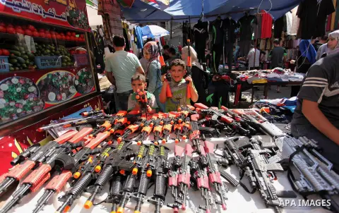 Palestinians shop at market ahead of the Eid al-Fitr holiday in Gaza city, on July 05, 2016, as Muslims the world over prepare to celebrate Eid al-Fitr, starting with the with the sighting of the new moon, to mark the en...