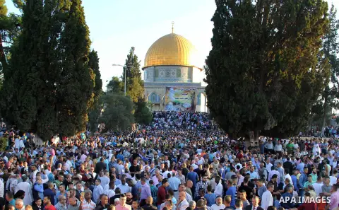 Palestinian Muslim after perform the morning Eid al-Fitr prayer near the Dome of Rock at the Al-Aqsa Mosque compound, Islam's third most holy site, in the old city of Jerusalem on July 6, 2016. Muslims worldwide celebrat...