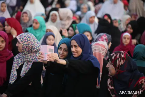 Palestinians attend the morning prayers for Eid al-Fitr celebrations, which marks the end of the holy fasting month of Ramadan, in Gaza City July 6, 2016. Photo by Ashraf Amra