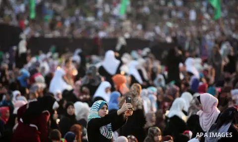 Palestinians attend the morning prayers for Eid al-Fitr celebrations, which marks the end of the holy fasting month of Ramadan, in Gaza City July 6, 2016. Photo by Ashraf Amra