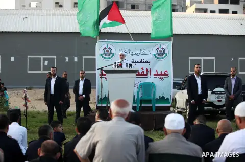 Senior Hamas leader Ismail Haniyeh leads the morning prayers for Eid al-Fitr celebrations, which marks the end of the holy fasting month of Ramadan, in Gaza City July 6, 2016. Photo by Ashraf Amra
