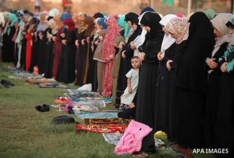 Palestinians attend the morning prayers for Eid al-Fitr celebrations, which marks the end of the holy fasting month of Ramadan, in Gaza City July 6, 2016. Photo by Ashraf Amra