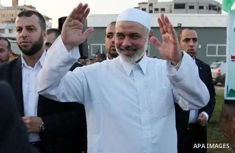 Senior Hamas leader Ismail Haniyeh leads the morning prayers for Eid al-Fitr celebrations, which marks the end of the holy fasting month of Ramadan, in Gaza City July 6, 2016. Photo by Ashraf Amra
