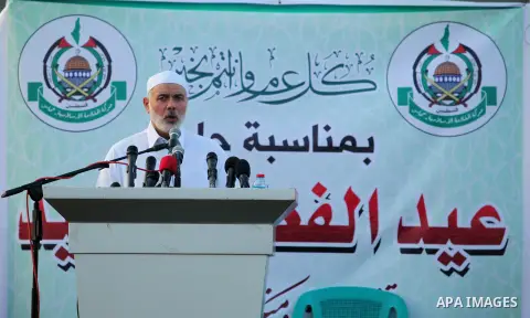 Senior Hamas leader Ismail Haniyeh leads the morning prayers for Eid al-Fitr celebrations, which marks the end of the holy fasting month of Ramadan, in Gaza City July 6, 2016. Photo by Ashraf Amra