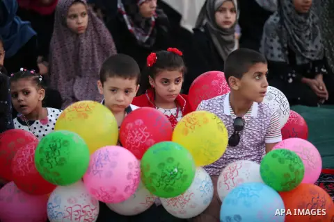 Palestinians attend the morning prayers for Eid al-Fitr celebrations, which marks the end of the holy fasting month of Ramadan, in Gaza City July 6, 2016. Photo by Ashraf Amra