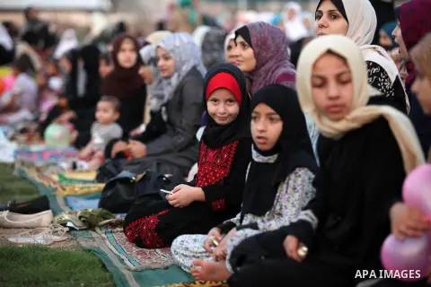 Palestinians attend the morning prayers for Eid al-Fitr celebrations, which marks the end of the holy fasting month of Ramadan, in Gaza City July 6, 2016. Photo by Ashraf Amra