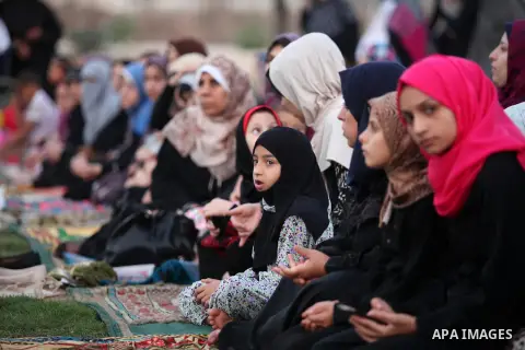 Palestinians attend the morning prayers for Eid al-Fitr celebrations, which marks the end of the holy fasting month of Ramadan, in Gaza City July 6, 2016. Photo by Ashraf Amra