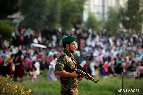 A member of Palestinian security forces loyal to Hamas stands guard during the morning prayers for Eid al-Fitr celebrations, which marks the end of the holy fasting month of Ramadan, in Gaza City July 6, 2016. Photo by A...