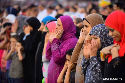 Egyptian Muslims attend the morning prayers for Eid al-Fitr celebrations, which marks the end of the holy fasting month of Ramadan, outside Amr Ibn El-Aas mosque, in Cairo, Egypt, on July 06, 2016. Photo by Amr Sayed