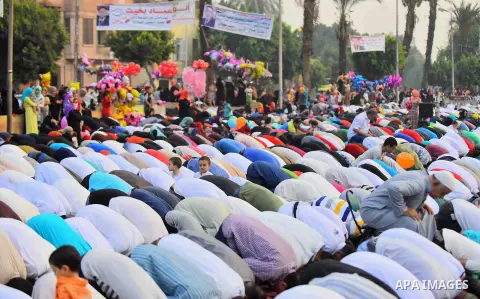 Egyptian Muslims attend the morning prayers for Eid al-Fitr celebrations, which marks the end of the holy fasting month of Ramadan, outside Amr Ibn El-Aas mosque, in Cairo, Egypt, on July 06, 2016. Photo by Amr Sayed