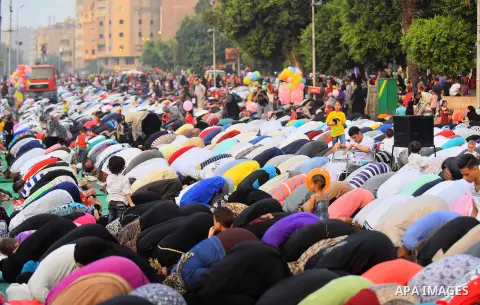 Egyptian Muslims attend the morning prayers for Eid al-Fitr celebrations, which marks the end of the holy fasting month of Ramadan, outside Amr Ibn El-Aas mosque, in Cairo, Egypt, on July 06, 2016. Photo by Amr Sayed