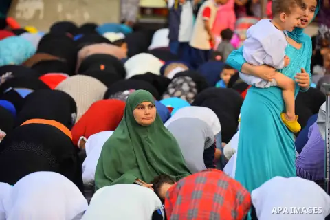 Egyptian Muslims attend the morning prayers for Eid al-Fitr celebrations, which marks the end of the holy fasting month of Ramadan, outside Amr Ibn El-Aas mosque, in Cairo, Egypt, on July 06, 2016. Photo by Amr Sayed