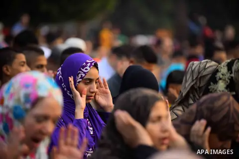 Egyptian Muslims attend the morning prayers for Eid al-Fitr celebrations, which marks the end of the holy fasting month of Ramadan, outside Amr Ibn El-Aas mosque, in Cairo, Egypt, on July 06, 2016. Photo by Amr Sayed