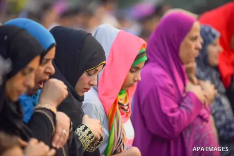 Egyptian Muslims attend the morning prayers for Eid al-Fitr celebrations, which marks the end of the holy fasting month of Ramadan, outside Amr Ibn El-Aas mosque, in Cairo, Egypt, on July 06, 2016. Photo by Amr Sayed