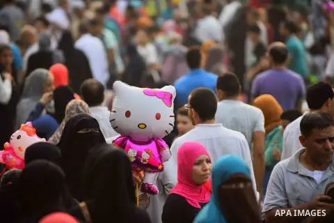 Egyptian Muslims attend the morning prayers for Eid al-Fitr celebrations, which marks the end of the holy fasting month of Ramadan, outside Amr Ibn El-Aas mosque, in Cairo, Egypt, on July 06, 2016. Photo by Amr Sayed