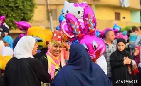 Egyptian Muslims attend the morning prayers for Eid al-Fitr celebrations, which marks the end of the holy fasting month of Ramadan, outside Amr Ibn El-Aas mosque, in Cairo, Egypt, on July 06, 2016. Photo by Amr Sayed