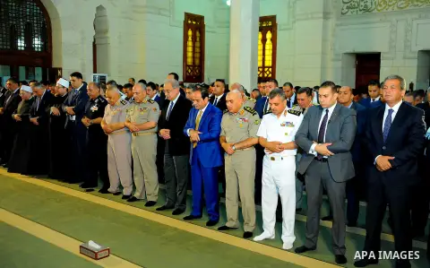 A handout picture released by the Egyptian Presidency on July 4, 2016, shows Egyptian President Abdel Fattah al-Sisi attends the morning prayers for Eid al-Fitr celebrations, which marks the end of the holy fasting month...